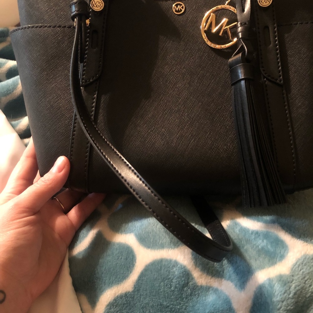 Authentic Michael Kors. Used once. It is in PERFECT like-new condition.